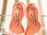 cute pink peep toe slingbacks with skulls are a very cute and lovely touch to the Halloween bridal look