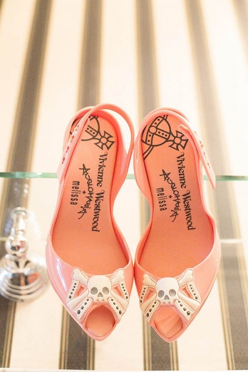cute pink peep toe slingbacks with skulls are a very cute and lovely touch to the Halloween bridal look