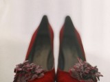 red velvet shoes with dark and red fabric blooms on them look veyr Halloween-like and very bold