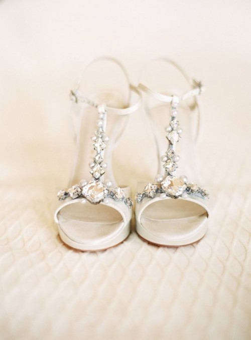 delicate white embellished wedding shoes with T straps and ankle straps are amazing for a spring or summer wedding