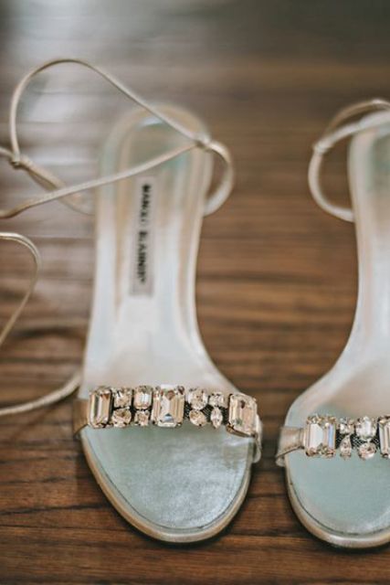 silver wedding shoes with delicate and subtle straps and heavy embellishments are a lovely idea for a wedding with a touch of metallics