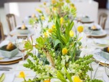 a bright wedding tablescape with greenery, billy balls and succulents, neutral linens, mint porcelain and pears