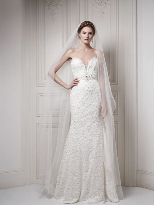a breathtaking lace mermaid wedding dress with a sweetheart neckline, embellishments and an embellished sash, a long veil is wow