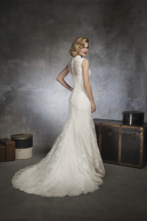 a vintage lace mermaid wedding dress with a turtleneck, an illusion back, a train is a chic and stylish solution to rock at a vintage-inspired wedding