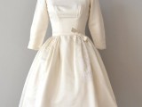 a plain A-line tea-length wedding dress with a pleated skirt, short sleeves, a square neckline is a stylish idea for a vintage or retro wedding