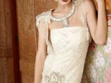 a bold and kitschy 20s inspired wedding dress with an embellished front detail and shoulders, with lace and embellishments on the dress itself is very cool