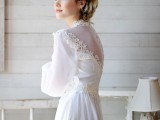 a beautiful vintage A-line wedding dress of plain fabric and lace, with puff sleeves, buttons on the back