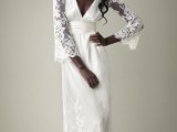 a refined and chic lace A-line wedding dress with a deep neckline, bell sleeves, a train and a matching headpiece are a gorgeous combo for a vintage wedding