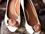 vintage white shoes with brown leather flowers look stylish and bold and add interest to the space