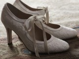 white vintage shoes of lace, with cutouts and ribbons bows look romantic and refined