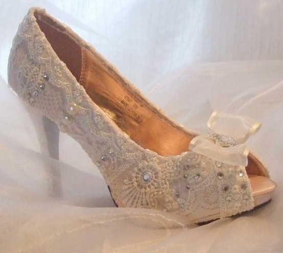 White lace peep toe fully embellished heels bring a sophisticated feel to the bridal look