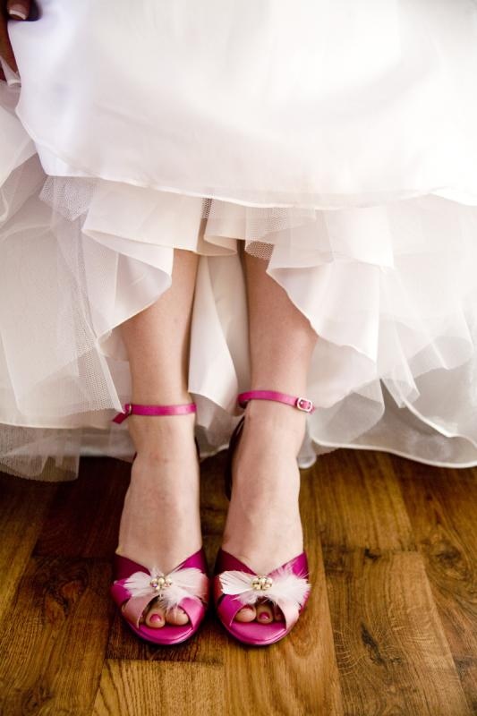 Hot pink vintage peep toe wedding shoes with beads and feathers for adding a vintage feel and a bold touch to the look