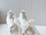 vintage white lace cutout wedding shoes with large ribbon bows look chic and refined