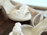 ivory peep toe shoes with fabric flowers and ankle straps look stylish and elegant