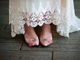 vintage tan wedding shoes with embellishments and pink feathers add a refined and romantic touch to the look