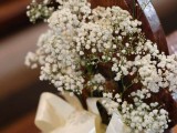baby’s breath with a white ribbon bow are an elegant and chic posie to decorate your aisle and make it look classic and refined