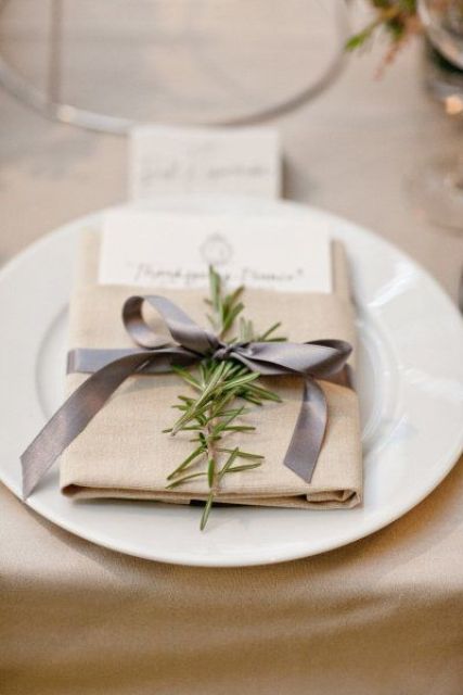 add rosemary branches to place settings to make your wedding decor fresher and cooler