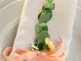 eucalyptus, a single bloom and a peachy bow will spruce up your place setting in a chic and bold way