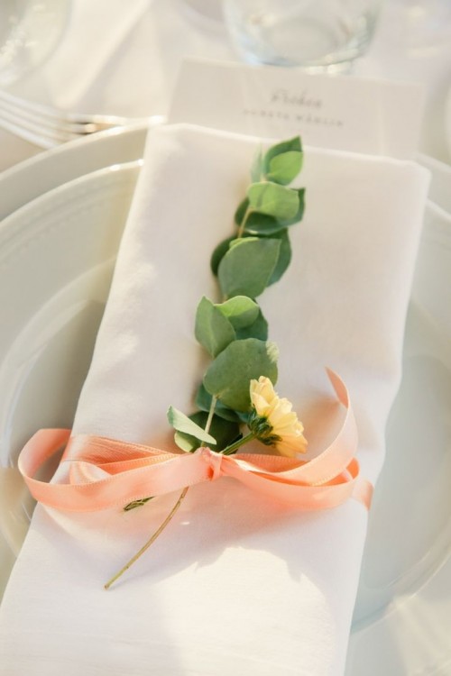 eucalyptus, a single bloom and a peachy bow will spruce up your place setting in a chic and bold way
