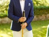 a navy blazer, a white shirt, a printed light blue bow tie and white pants create a contrasting look for your wedding