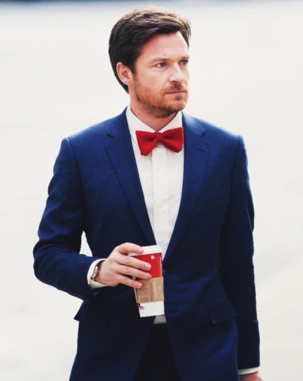 A navy suit, a white shirt and a bold red bow tie will make your look contrasting, bold and catchy