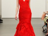 a modern hot red mermaid wedding dress with a draped bodice, a plunging neckline, thick straps and ruffle and layered skirt plus a train