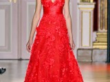 a jaw-dropping hot red A-line wedding dress with a floral applique bodice and skirt, a deep neckline and thick straps