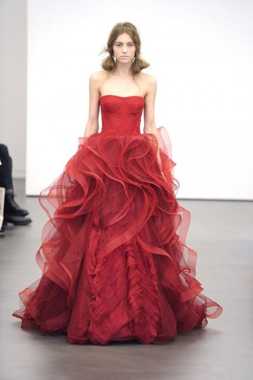a modern burgundy wedding ballgown with a sleek bodice and a ruffle skirt plus a train wows with its design and unique look