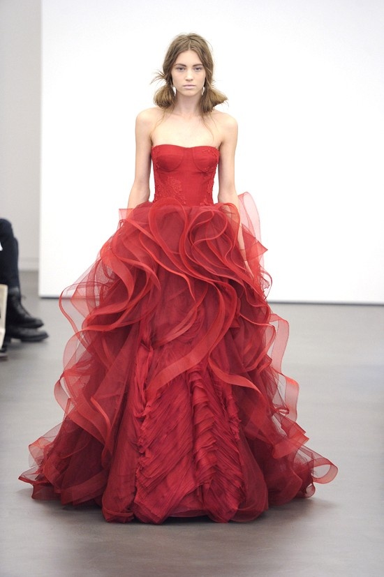 a modern burgundy wedding ballgown with a sleek bodice and a ruffle skirt plus a train wows with its design and unique look