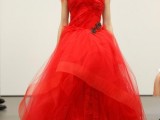 a one shoulder hot red wedding ballgown with a draped bodice and a layered full skirt, with black embellishments is a fantastic idea for a Halloween wedding