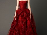 a strapless burgundy wedding dress with a draped bodice and lace and ruffle skirt will be a nice fit for a dramatic Halloween wedding