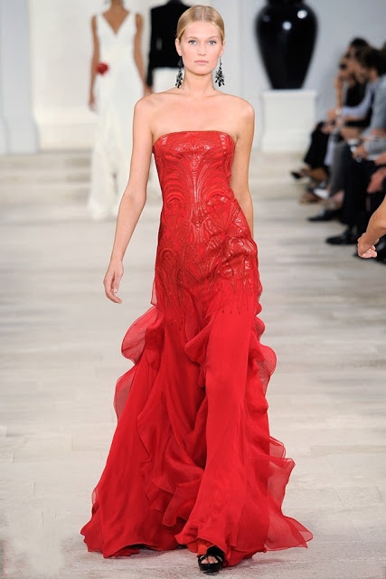 a strapless hot red A-line wedding dress with a shiny and sparkling bodice and a ruffle skirt is a lovely idea for a modern wedding