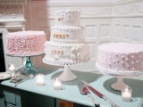 simple sheer, pink and white cake stands and an assortment of pink and white wedding cakes