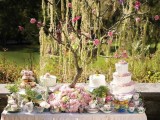 simple stands for wedding cakes and lots of blooms and vintage teacups to make the sweet table look vintage and sweet