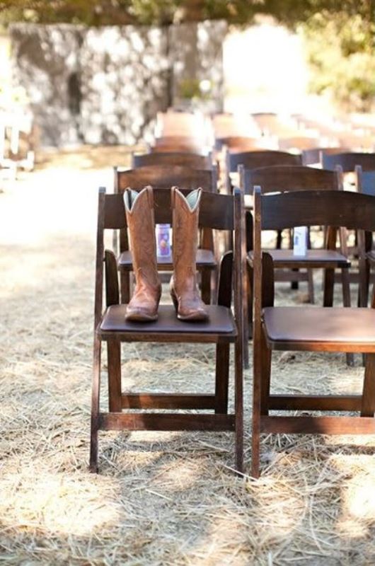 place cowboy boots on a chair in your wedding ceremony space   these boots are faves from a person who is gone