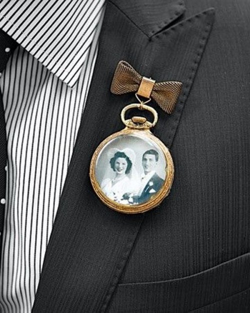 a wedding boutonniere of a vintage pocket watch with a black and white photo of the people who are gone but loved