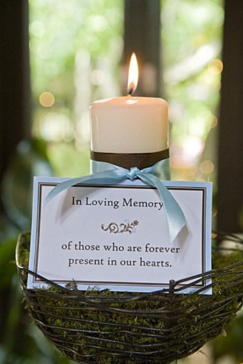 a next candleholder with a pillar candle and a sign with a quote about loving those who are gone