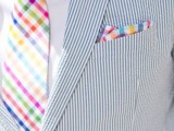 a bright summer groom’s look with a thin striped suit, a bright plaid tie and a handkerchief is a gorgeous idea for a colorful summer wedding
