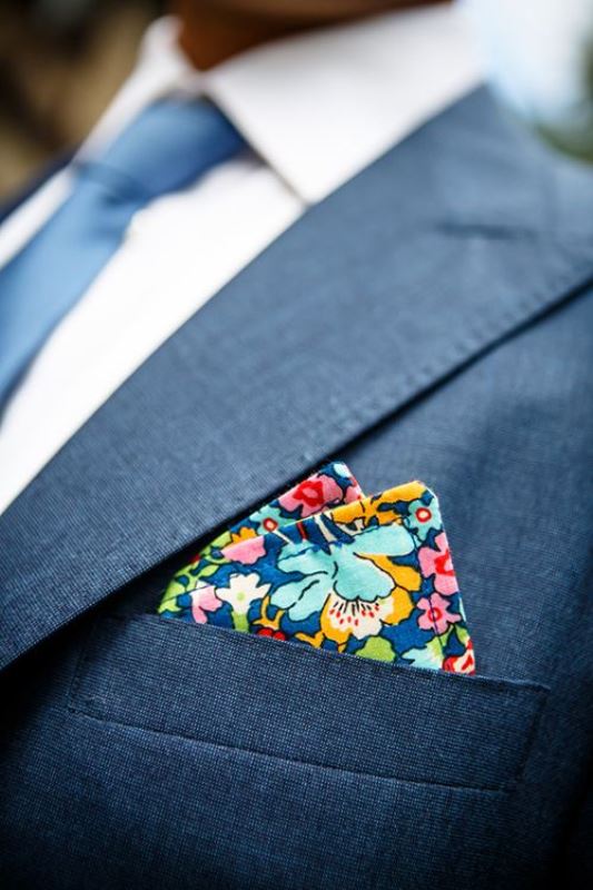 A pocket square done with a super bold printed handkerchief is a lovely idea for a wedding with plenty of color
