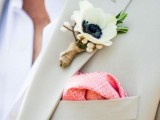 a summer groom’s look with a creamy suit, a white shirt, a white anemone boutonniere and a pink handkerchief is perfect for hot locations and tropical weddings