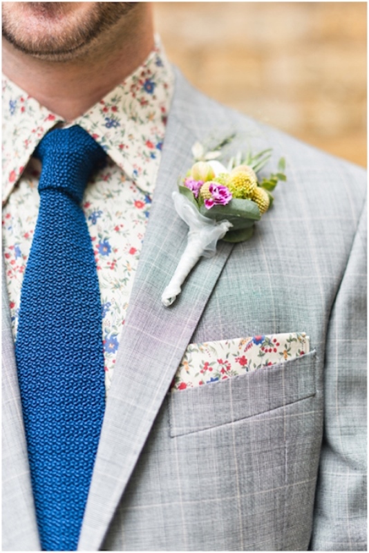 A colorful floral boutonniere and a bold floral shirt plus a matching handkerchief in the pocket square is amazing