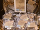 a vintage round suitcase filled with paper and with wedding favors with cards is a cool idea for a vintage or rustic wedding
