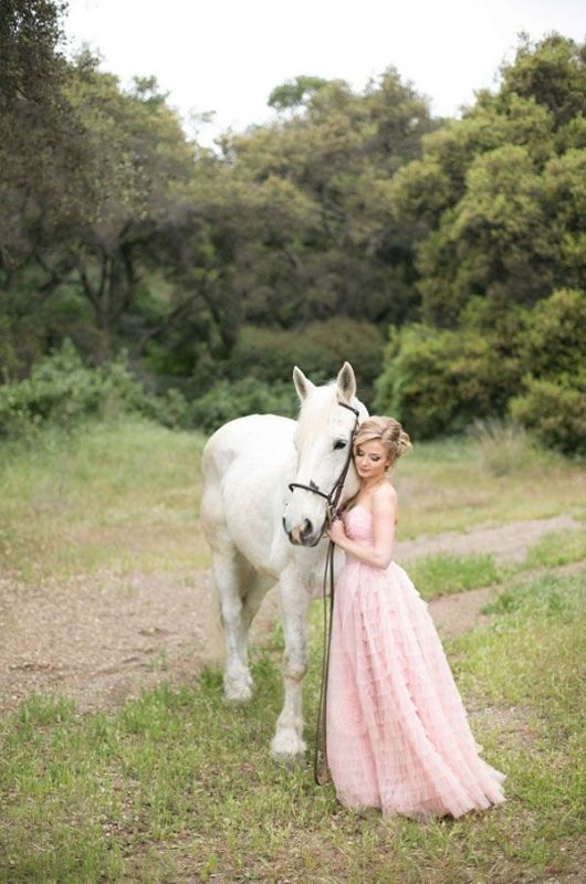 a strapless blush wedding dress with a draped bodice, a ruffle skirt is veyr romantic and feels princess like