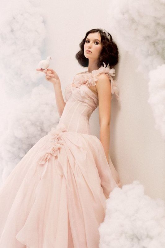 a blush wedding ballgown with a lace one shoulder strap, a layered skirt for a modern princess