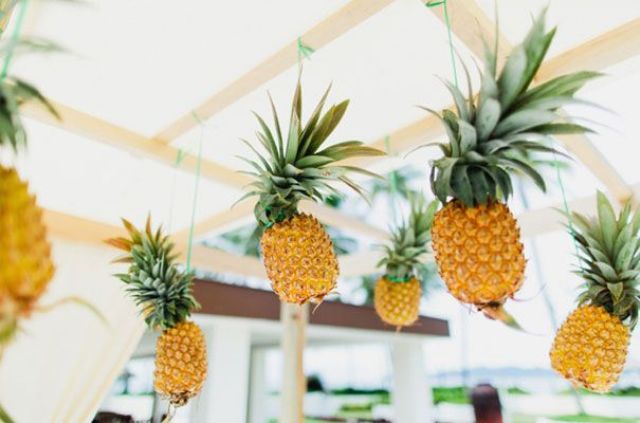 Hang some pineapples over the reception space to make it feel really tropical and bold