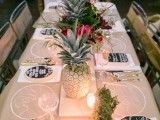 whitewashed pineapples and super bold blooms and candles will make up a chic and bright modern tropical table setting