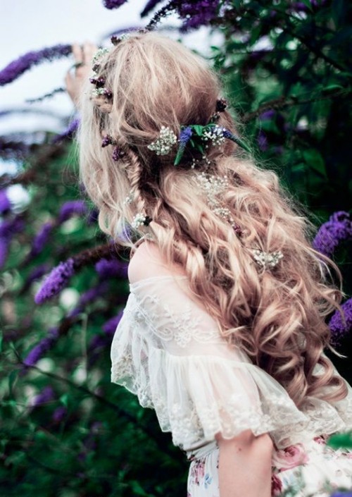 a half updo with waves, twists and braids, with greenery and blooms is a great solution for a boho bride, a spring or a summer one