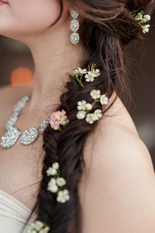 fishtail braid with some flowers tucked in is a lovely idea for a boho bride