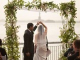 a greenery and white bloom wedding arch is sprign classics that always works