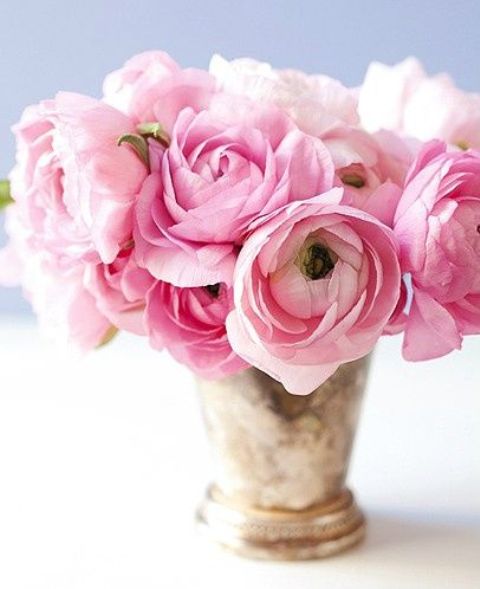 a refined vase with pink blooms is a timeless and chic Valentine's Day wedding centerpiece to rock